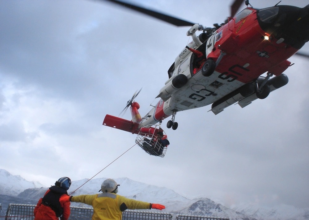 The HH-60 Jayhawk helicopter CG-6020 landing Selendang Ayu crewmembers on the flight deck of Alex Haley. (U.S. Coast Guard)